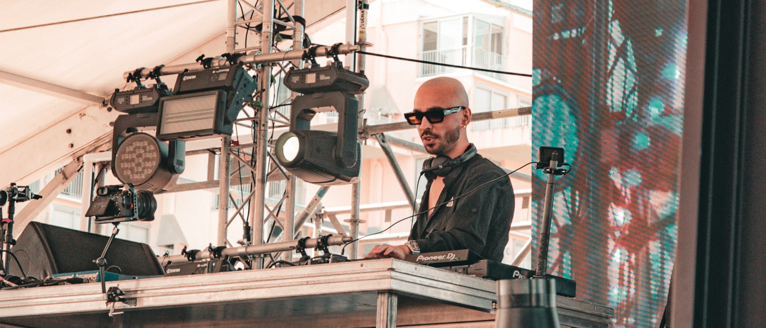 Henry Chris DJing at a Bangkok rooftop venue